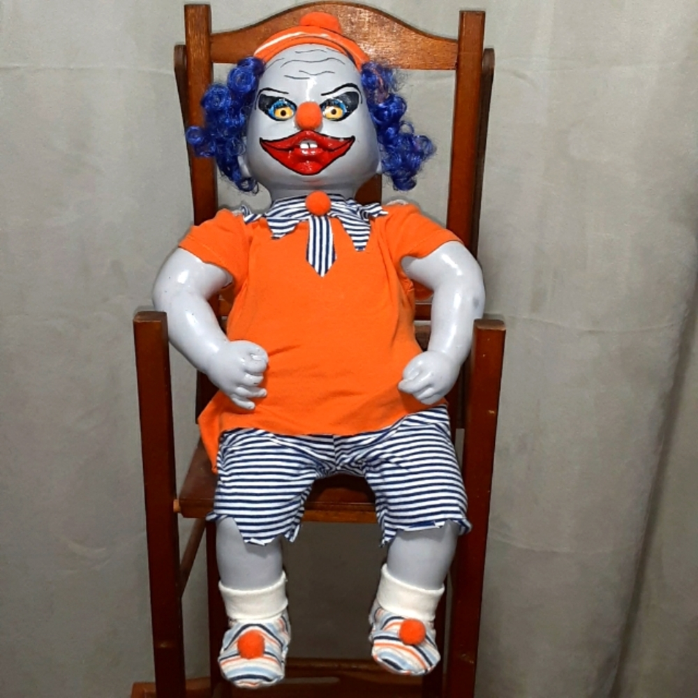 Hand painted one of a kind clown decoration.